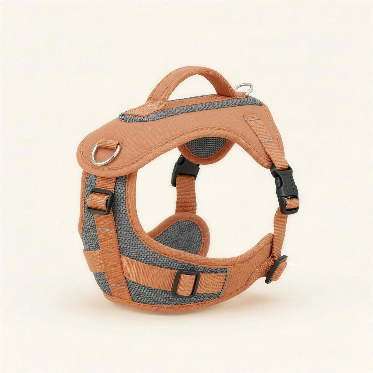 BerraPaws No-Pull Harness in Apricot, three-quarter view, showing the padded chest plate, the chest and back D-rings, the top handle and the reflective stitching.